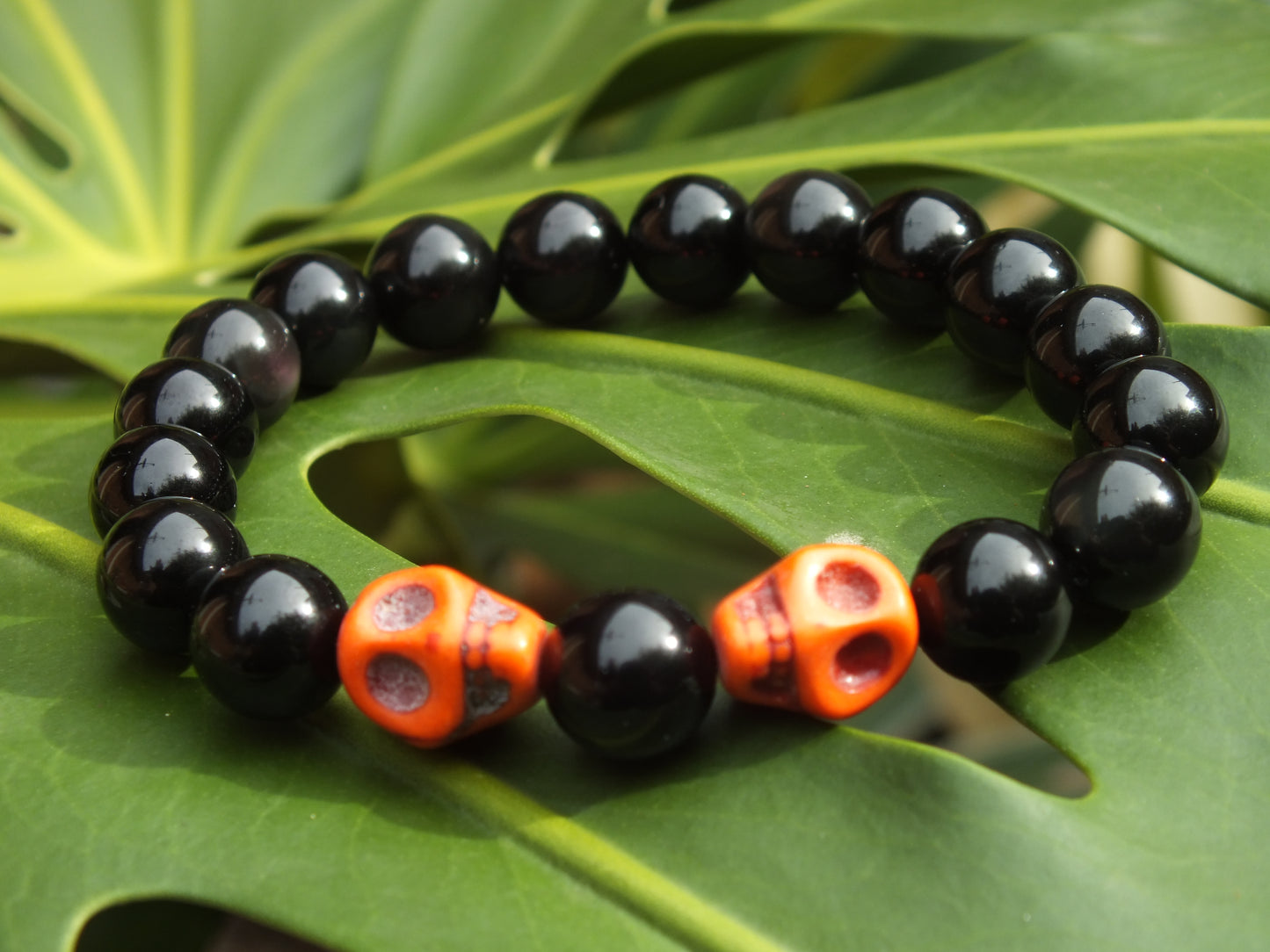 Obsidian & Orange Howlite Skull Braclet